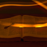 The,Open,Holy,Bible,Is,On,The,Table.,Ancient,Key.