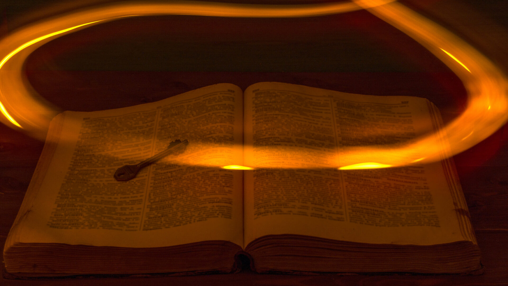 The,Open,Holy,Bible,Is,On,The,Table.,Ancient,Key.