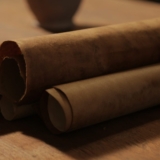 Bible,Scene:,A,Wooden,Dining,Table,With,Scripture,Scrolls.,Close-up