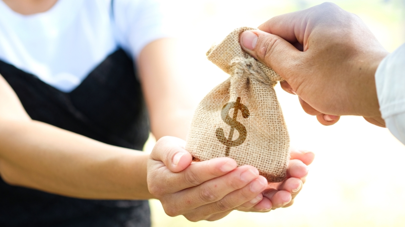 Man's,Hand.,He,Holds,A,Wallet,And,Gives,It,To