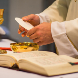 Priest,During,A,Wedding,Ceremony/nuptial,Mass,(shallow,Dof;,Color,Toned